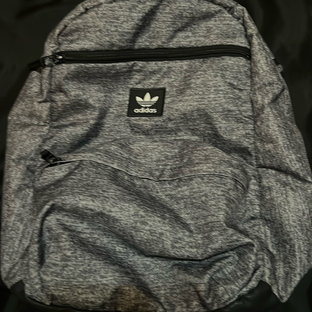Adidas padded strap backpack with inside mesh pocket and laptop pocket